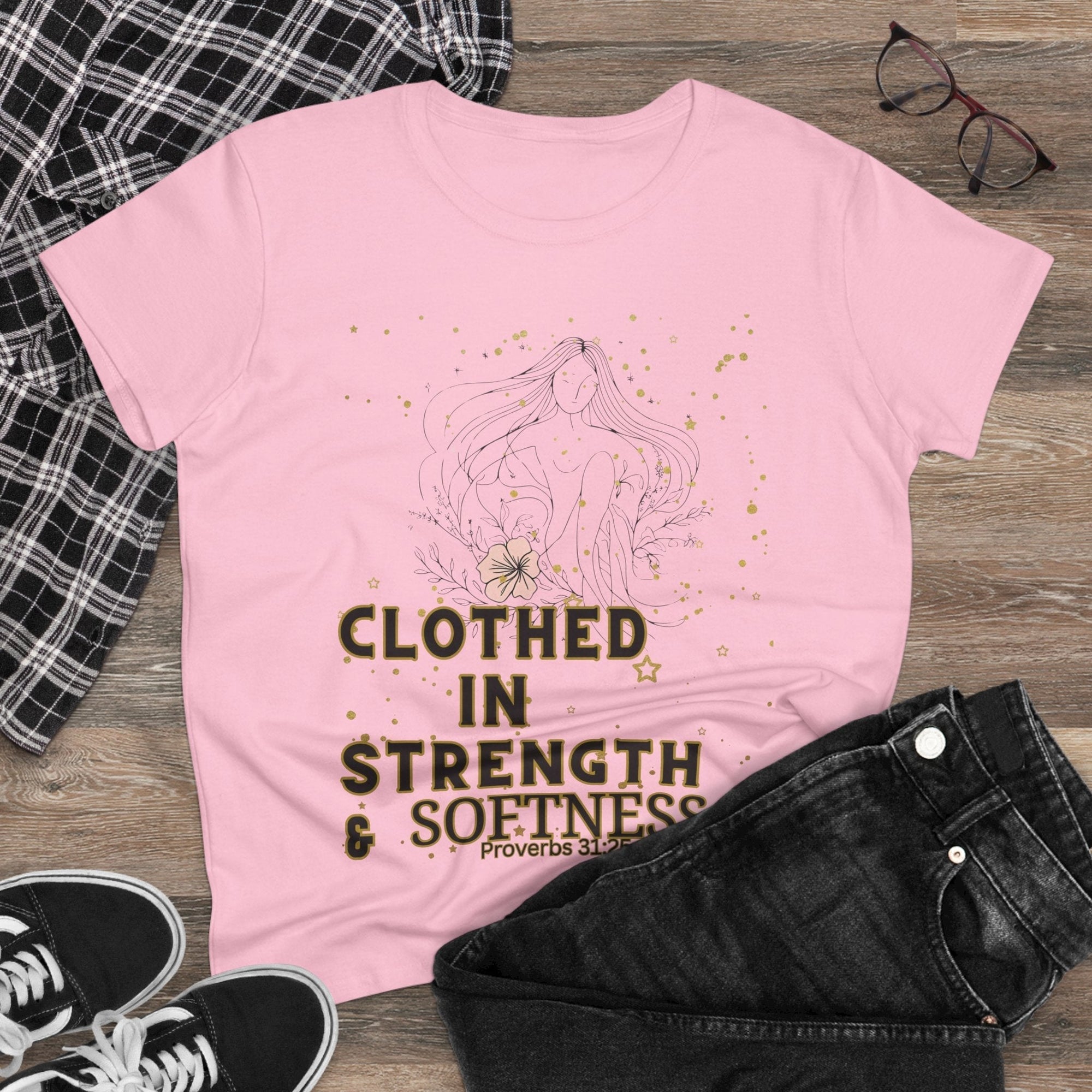 Women's inspirational cotton tee with "Clothed in Strength & Softness, Proverbs 31:25" design, showcasing empowerment and comfort.