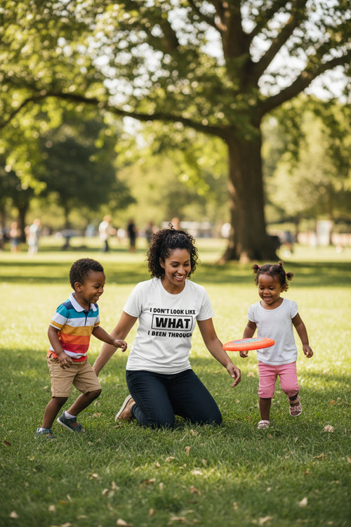 White unisex tee with bold black text reading I Don't Look Like What I Been Through