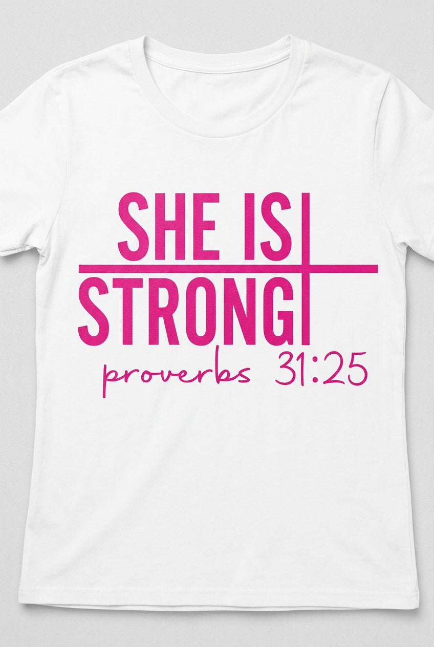 T-shirt with She Is Strong in bold pink lettering, a horizontal cross motif, and Proverbs 31:25 on white fabric.